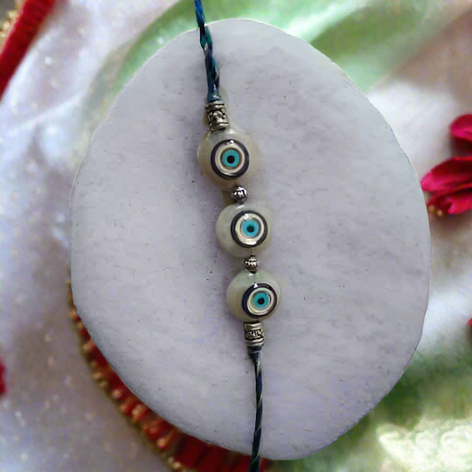 Blue Evil Eye Nazar Rakhi for Brother with Hamsa hand charm, pearl beads and handmade designer thread