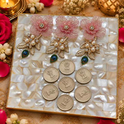 Decorative coin platter arranged for presenting coins during an Indian wedding shagun ceremony.