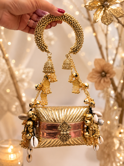Designer handcrafted metal clutch with beaded handle, ghungroo and shell detailing