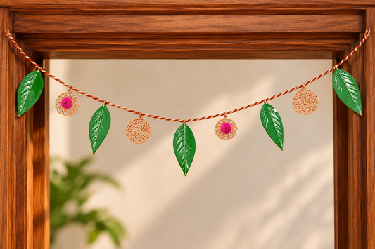 Diwali toran for main door with green leaves, gold accents and pink floral details
