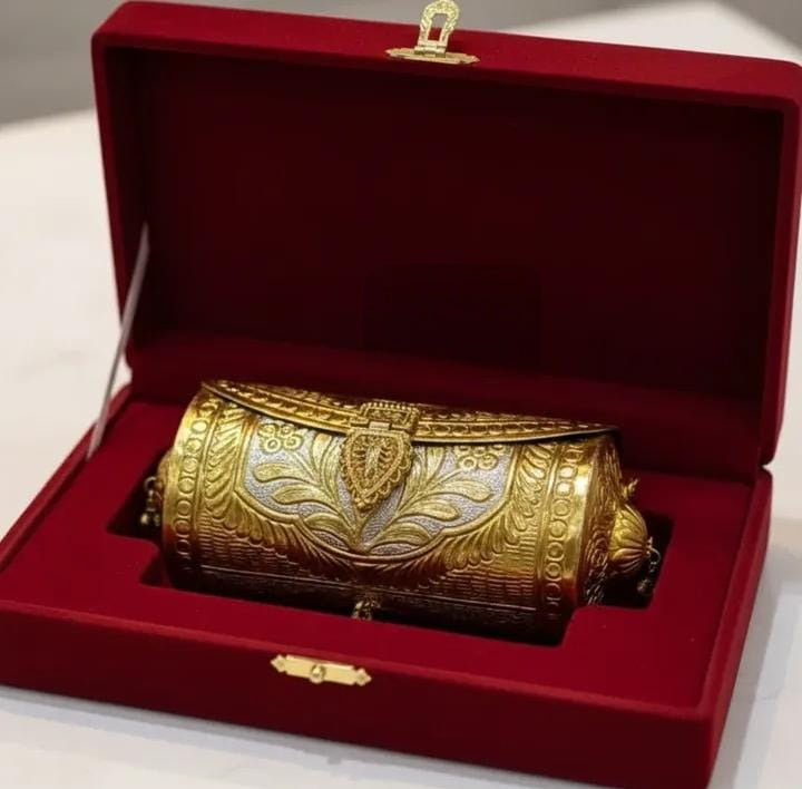 Double-tone brass gold metal clutch with antique-inspired detailing