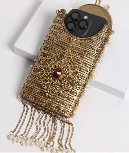 Emerald brass clutch with decorative pearl tassel detailing