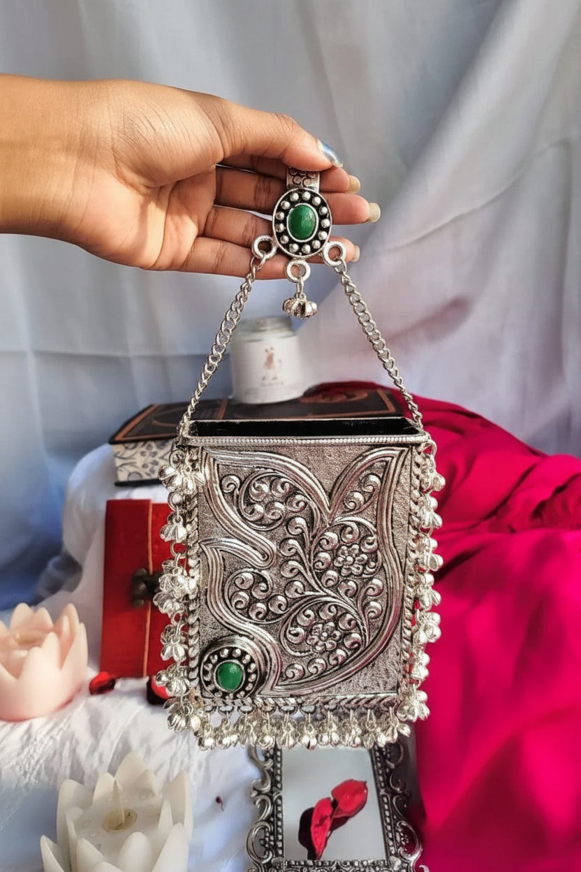 Ethnic silver brass clutch bag with decorative Ghoongroo tassel