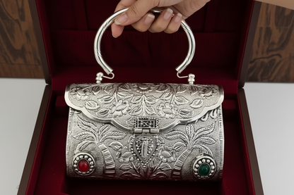 Floral carved heritage brass clutch with elegant gem accents