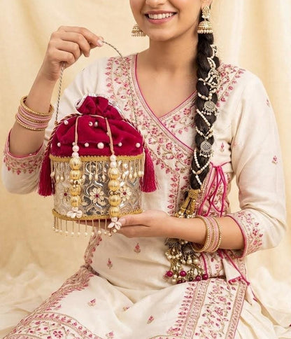 German silver metal potli bag with pink velvet and gold detailing