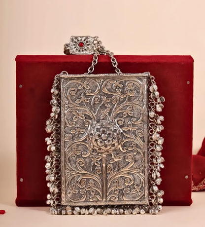 Brass clutch bag with decorative Ghungroo detailing for ethnic occasions
