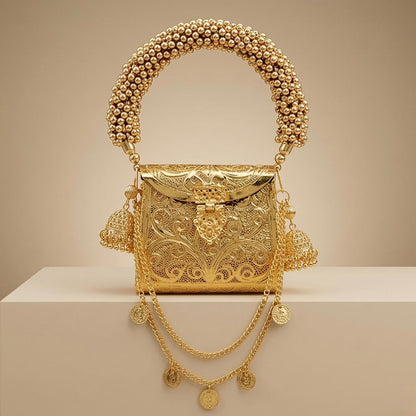 Golden Banjara mini metal clutch bag with an elegant gold finish for weddings and festive occasions