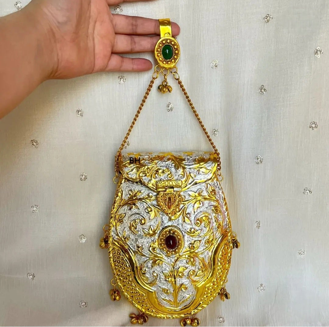 Golden designer clutch bag with traditional Ghungru detailing