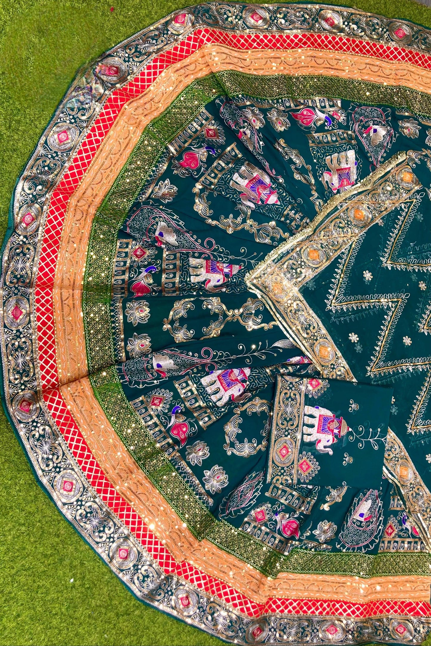 Green Rajasthani designer poshak with heavy traditional embroidery and embellished borders