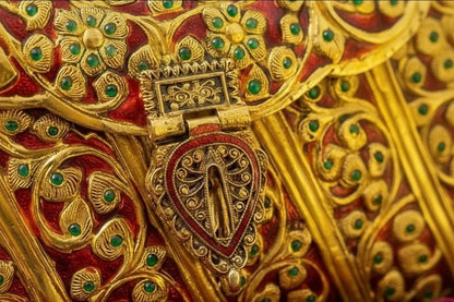 Handcrafted gold brass ethnic clutch with traditional Meenakari detailing