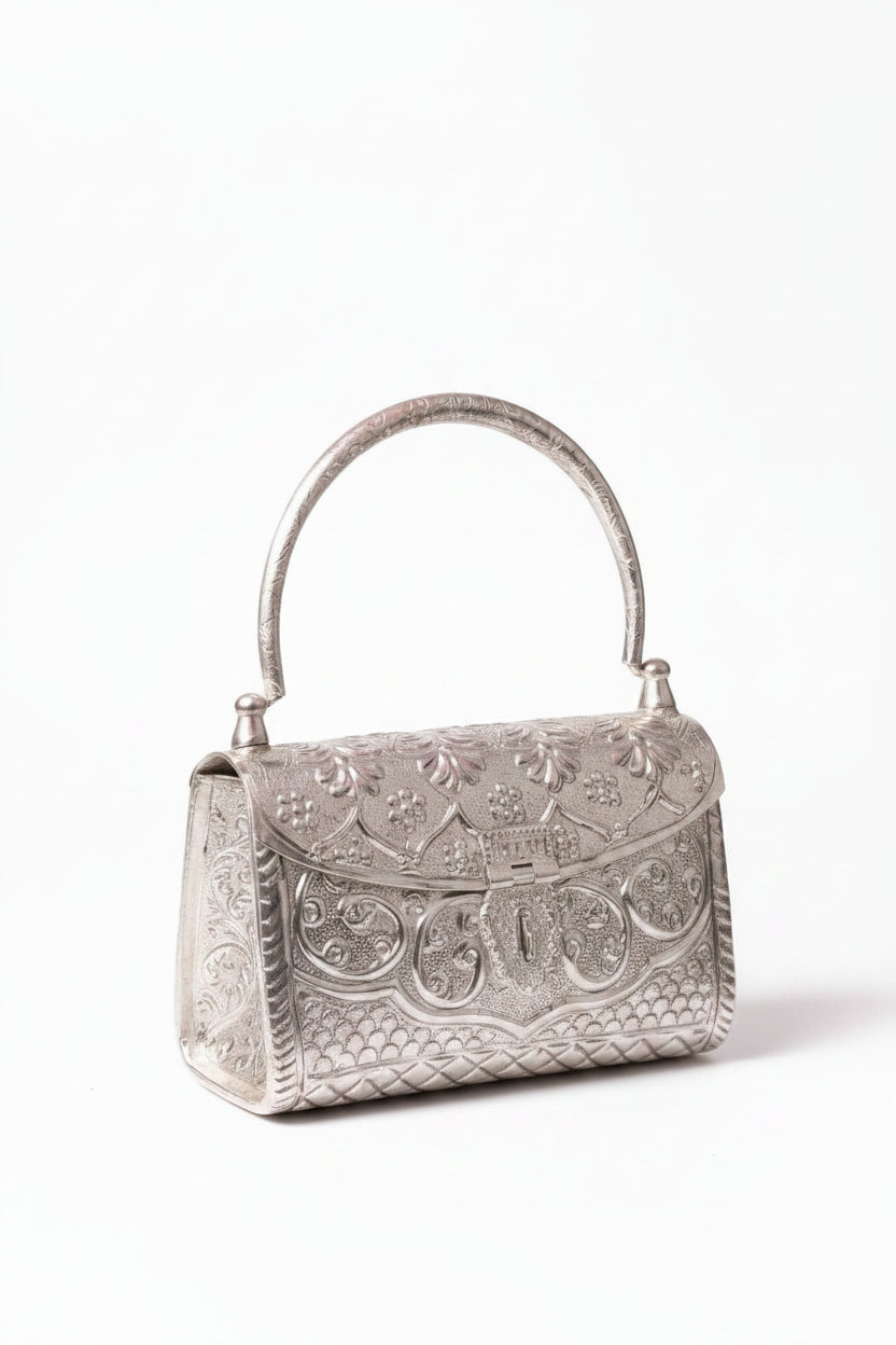 Handcrafted silver clutch purse with intricate designer detailing