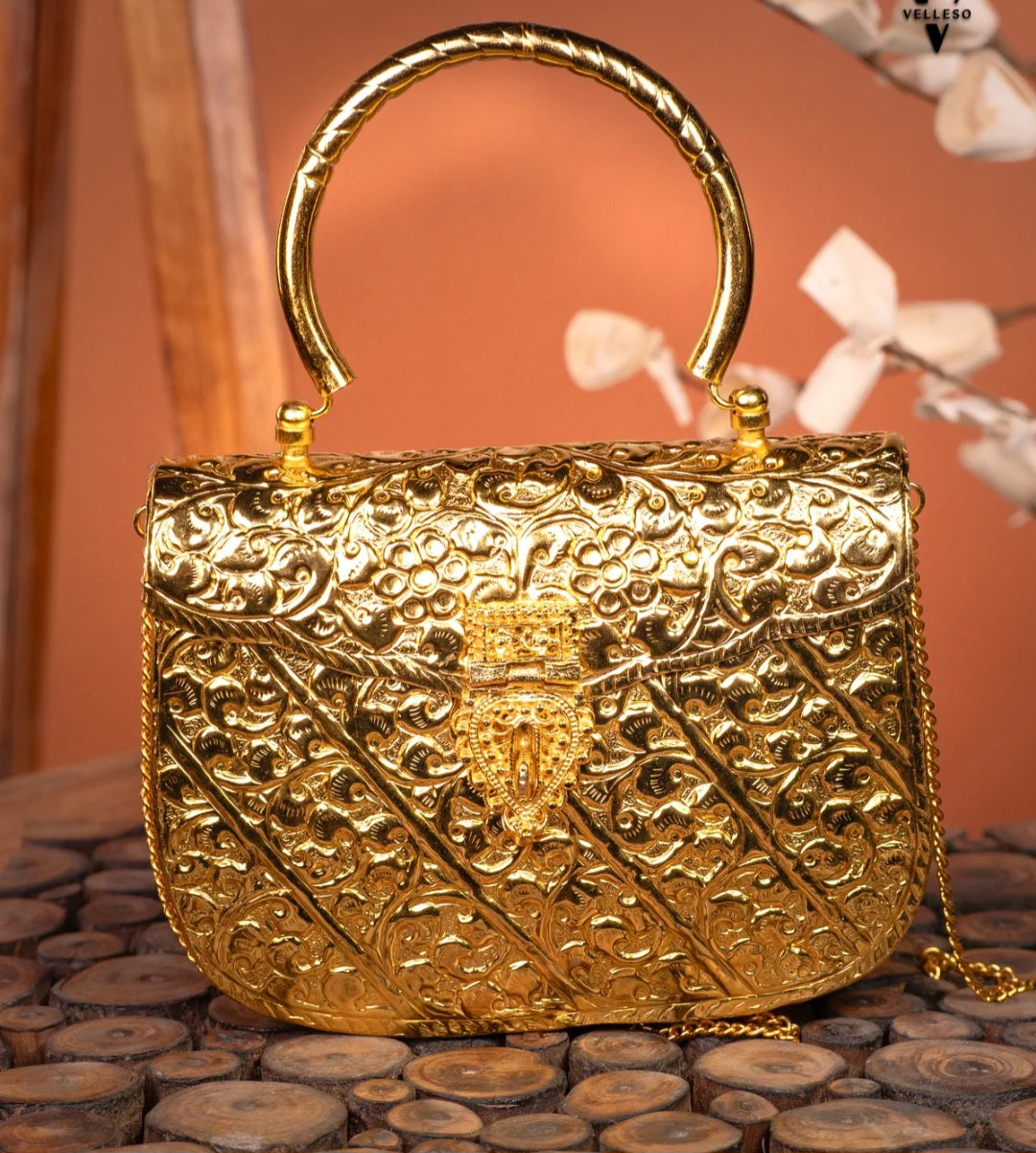 Heritage craftsmanship brass metal clutch with royal traditional design