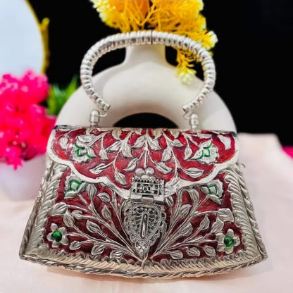 Heritage floral brass clutch with red Meena work and antique silver finish