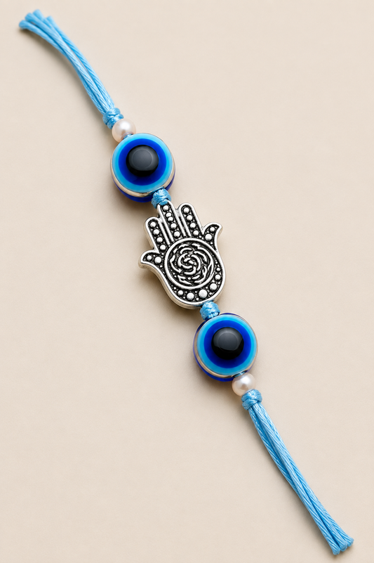 Jain Evil Eye Vibes Rakhi for Brother with blue evil eye beads, silver Hamsa hand charm and soft blue thread