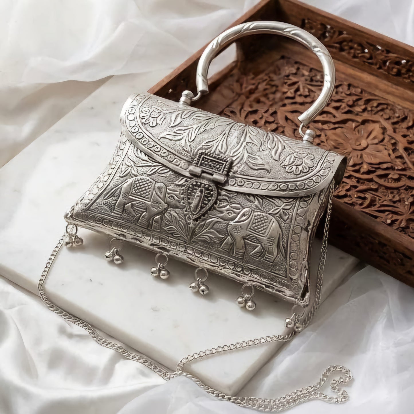 Maharani style elephant brass clutch bag with royal detailing