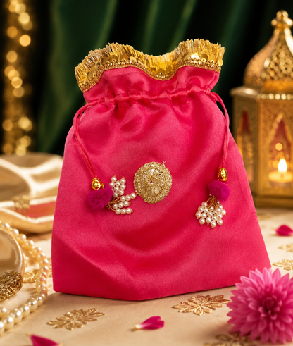 Close-up of pearl and gold embellishment on designer potli bag