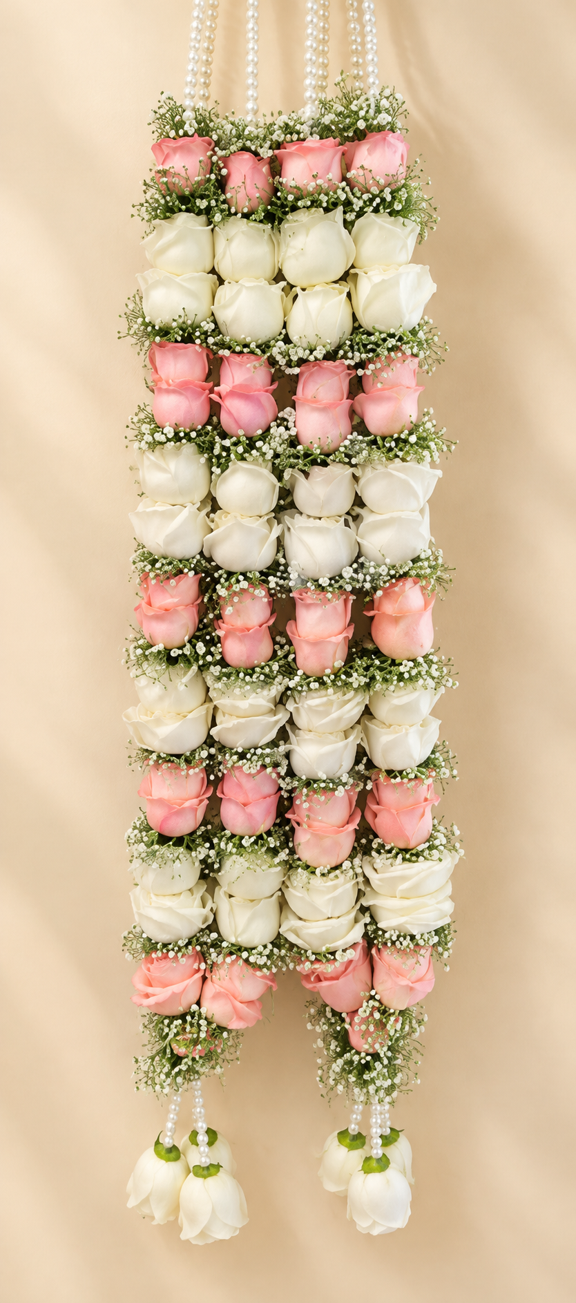 Pink and white rose varmala set with baby’s breath and pearl details for bride and groom wedding jaimala ceremony