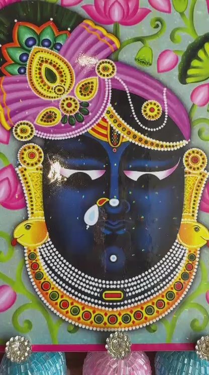 “Lighting up positivity with Shree Nath Ji rangoli & tealight aura ”
