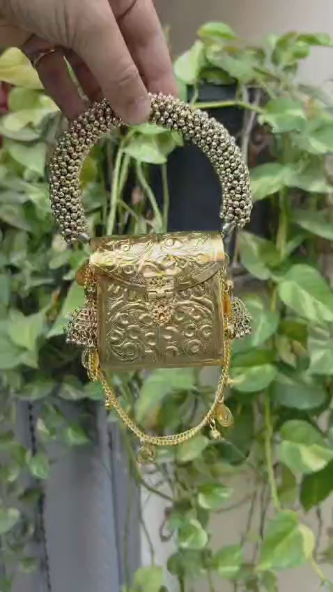 Golden Banjara mini metal purse with a long sling chain for carrying cash and small essentials