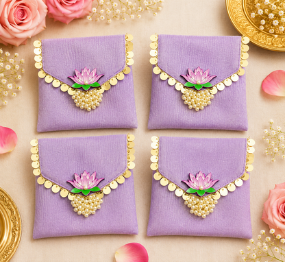 Purple organza wedding gift pouches with Moti Latkan detailing