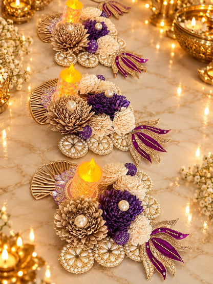 Close-up of purple and ivory sola flowers with pearl detailing on a decorative floral tealight candle holder