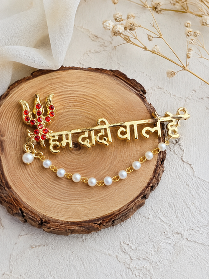 Rani Sati Dadi traditional metal brooch close up