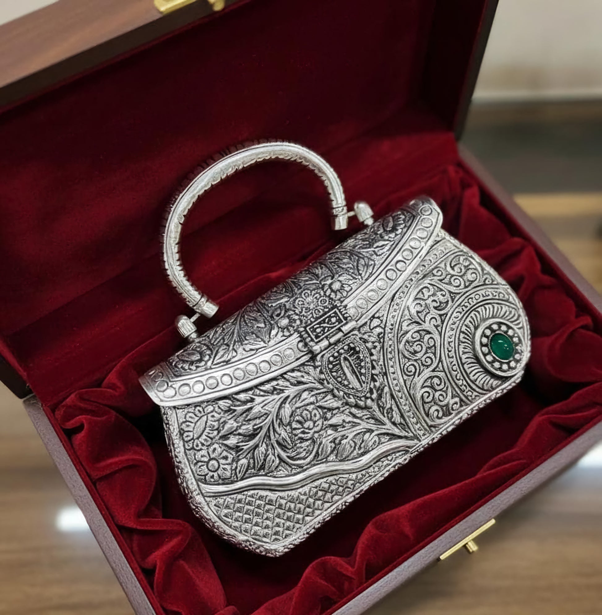 Regal Kundan-inspired brass metal clutch bag with traditional detailing