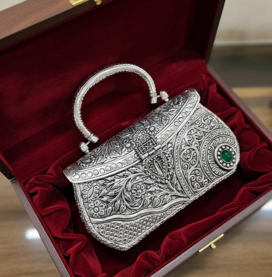 Regal Kundan-inspired brass metal clutch bag with traditional detailing