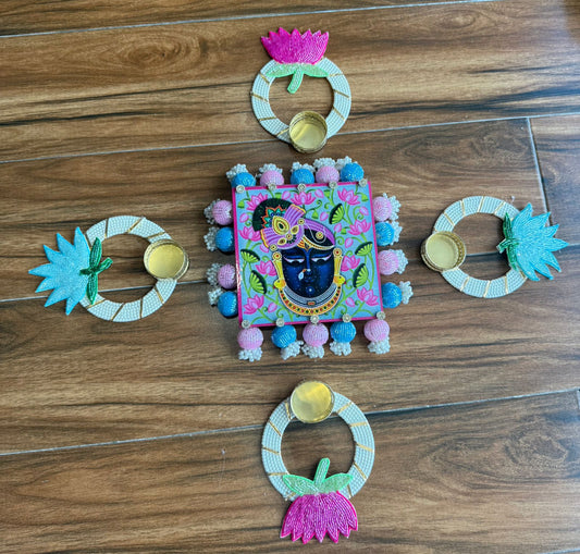 “Lighting up positivity with Shree Nath Ji rangoli & tealight aura ”