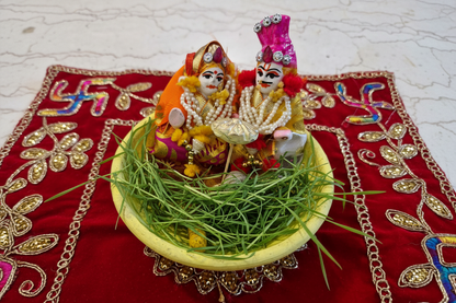 Eco-Friendly Gangaur Murti Set – Natural Clay Idol with Pooja Kit (Haldi, Kodi, Coin, Supari & Chunri)