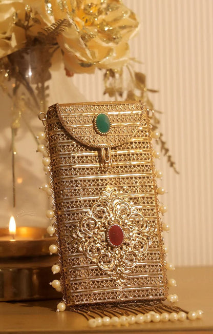 Royal emerald brass clutch bag with pearl tassels and ethnic detailing