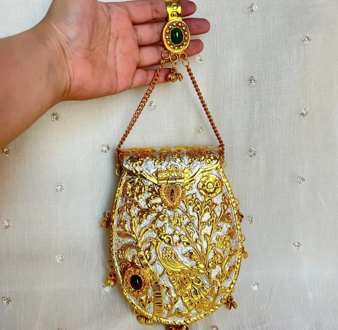 Royal golden handbag with distinctive Ghungru-inspired design