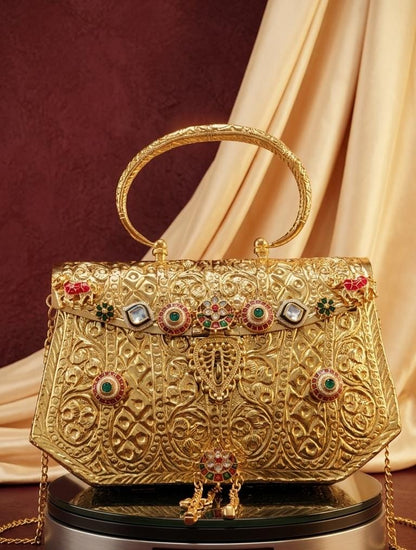 Royal gold-look Pachi Kundan bridal handbag with intricate embossed floral patterns, colourful stone embellishments, ornate top handle and long chain sling.