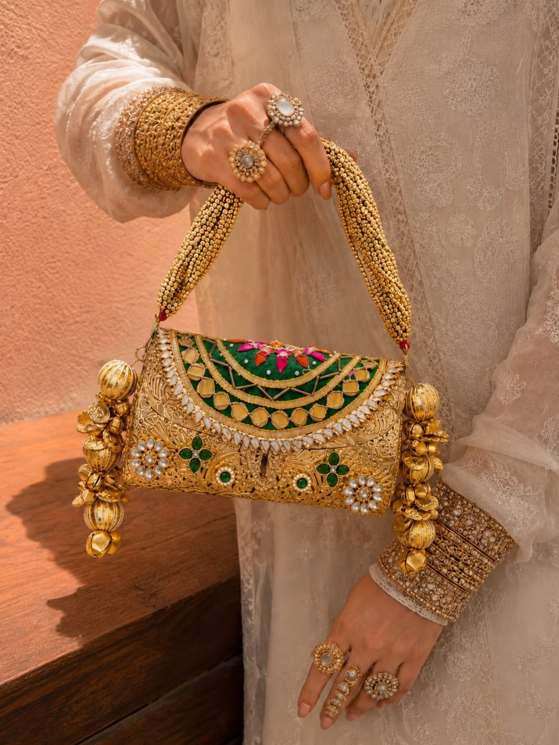 Royal Heritage handcrafted clutch with ornate gold embellishments