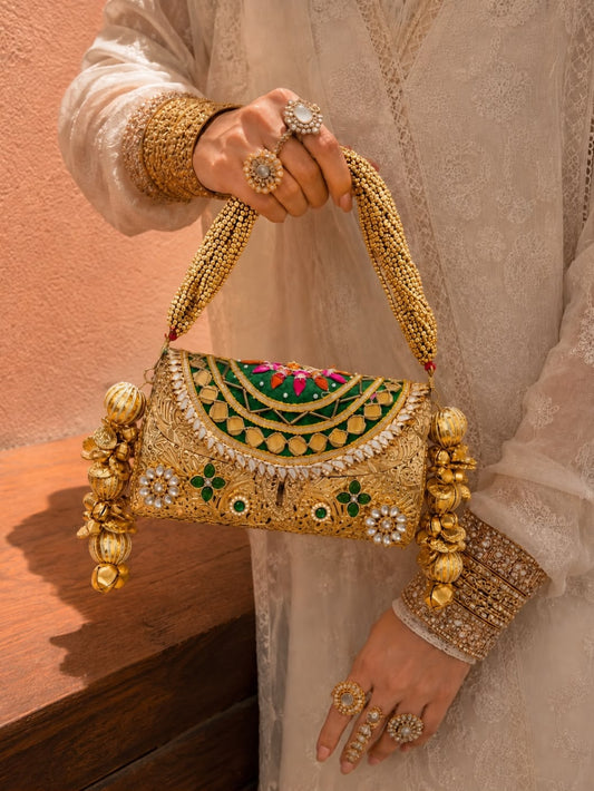 Royal Heritage handcrafted clutch with ornate gold embellishments