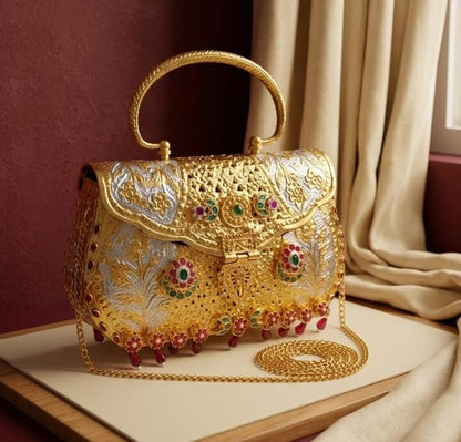 Royal Pachi Kundan bridal handbag with dual-tone gold and silver floral detailing, decorative stones, ornate handle and long sling chain.