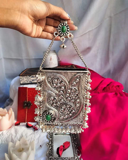 Traditional brass clutch with Ghoongroo tassel for ethnic outfits
