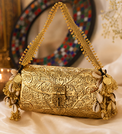 Traditional gold brass clutch purse with intricate ethnic design