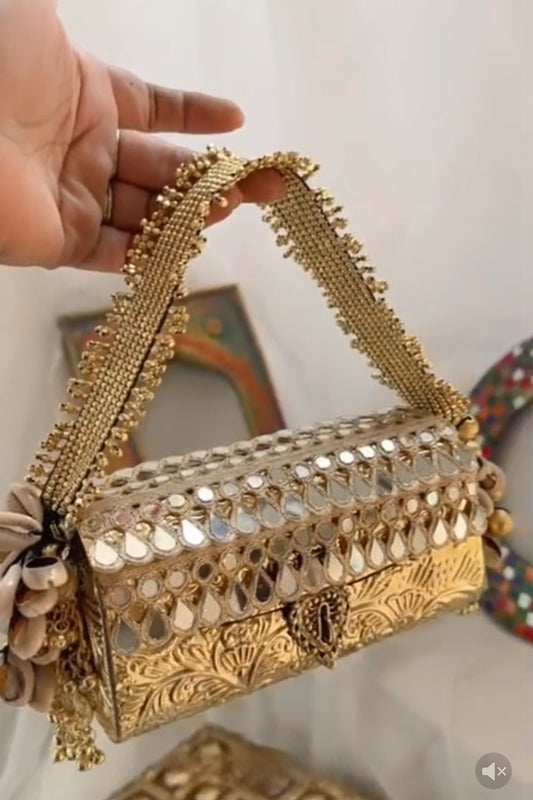 Vintage gold tone mirror clutch bag with antique ethnic detailing